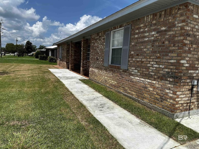 view of property exterior featuring a lawn