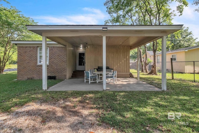 view of patio featuring entry steps and fence