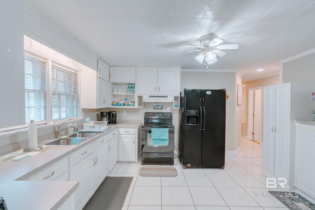 kitchen featuring under cabinet range hood, ornamental molding, a sink, white cabinetry, and black appliances