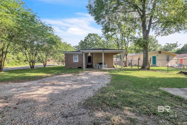 view of front facade with a front yard and fence