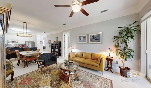 200 Peninsula Blvd Unit A202, Gulf Shores, AL 36542 - living area with a ceiling fan, light carpet, and ornamental molding
