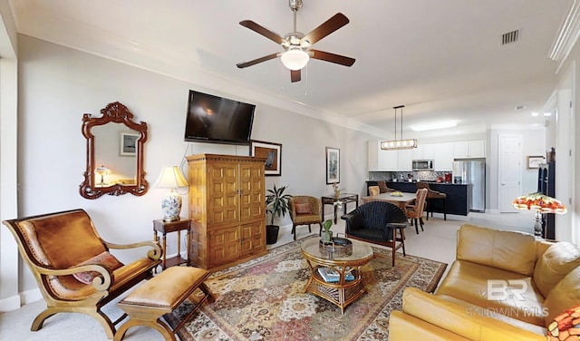 200 Peninsula Blvd Unit A202, Gulf Shores, AL 36542 - living room with crown molding, ceiling fan, light carpet, and a chandelier