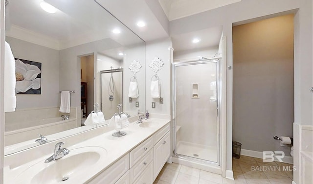 200 Peninsula Blvd Unit A202, Gulf Shores, AL 36542 - bathroom featuring a stall shower, double vanity, tile patterned flooring, a garden tub, and recessed lighting