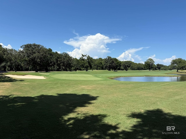 200 Peninsula Blvd Unit A202, Gulf Shores, AL 36542 - view of community featuring a water view, view of scattered trees, view of golf course, and a yard