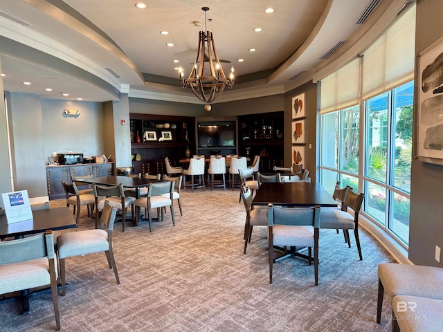 200 Peninsula Blvd Unit A202, Gulf Shores, AL 36542 - dining area featuring recessed lighting, a raised ceiling, a chandelier, healthy amount of natural light, and ornamental molding