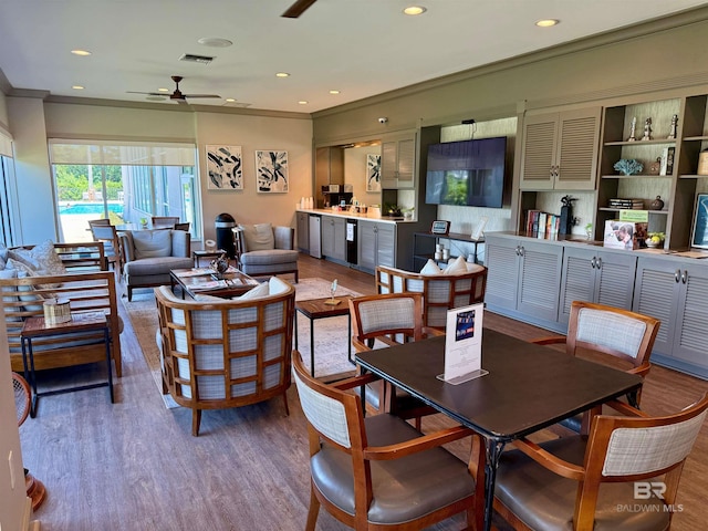 200 Peninsula Blvd Unit A202, Gulf Shores, AL 36542 - dining space featuring ceiling fan, wood finished floors, recessed lighting, and crown molding