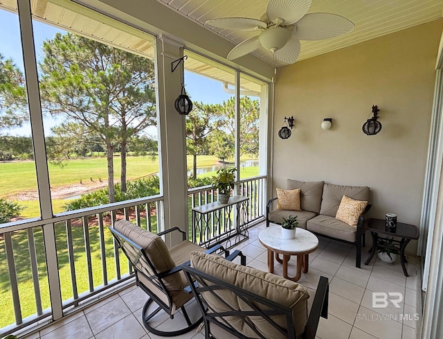 200 Peninsula Blvd Unit A202, Gulf Shores, AL 36542 - sunroom featuring a water view, a ceiling fan, and plenty of natural light