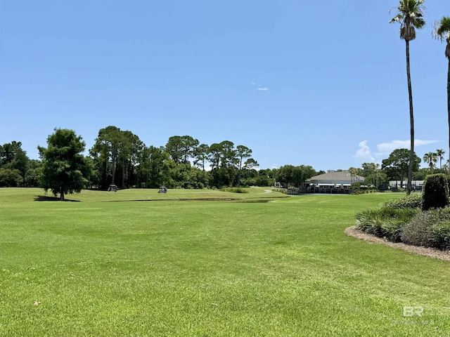 200 Peninsula Blvd Unit A202, Gulf Shores, AL 36542 - surrounding community featuring a yard, golf course view, and view of scattered trees