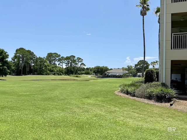 200 Peninsula Blvd Unit A202, Gulf Shores, AL 36542 - view of green lawn with view of scattered trees