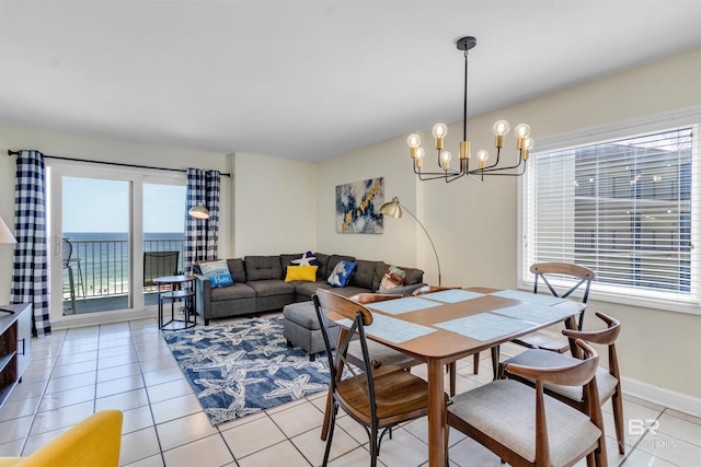 517 E Beach Blvd Unit 5D, Gulf Shores, AL 36542 - dining space featuring light tile patterned floors and a chandelier