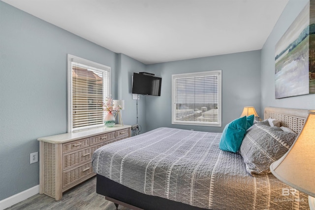 517 E Beach Blvd Unit 5D, Gulf Shores, AL 36542 - bedroom featuring wood finished floors and baseboards