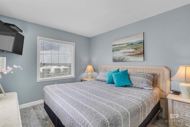 517 E Beach Blvd Unit 5D, Gulf Shores, AL 36542 - bedroom featuring wood finished floors and baseboards