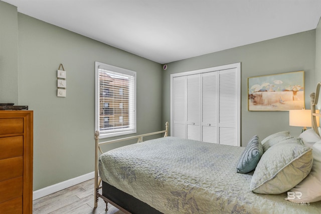 517 E Beach Blvd Unit 5D, Gulf Shores, AL 36542 - bedroom with wood finished floors and a closet