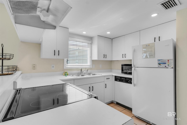 517 E Beach Blvd Unit 5D, Gulf Shores, AL 36542 - kitchen with white appliances, ventilation hood, white cabinetry, recessed lighting, and light countertops