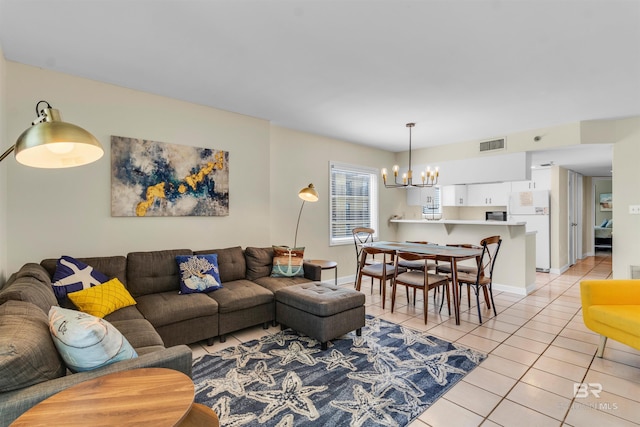 517 E Beach Blvd Unit 5D, Gulf Shores, AL 36542 - living area featuring a chandelier and light tile patterned flooring