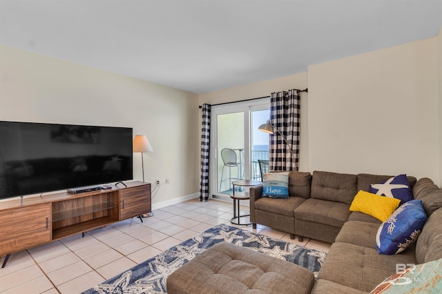 517 E Beach Blvd Unit 5D, Gulf Shores, AL 36542 - living room featuring light tile patterned floors and baseboards
