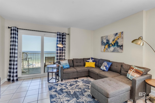 517 E Beach Blvd Unit 5D, Gulf Shores, AL 36542 - tiled living area with a water view and baseboards