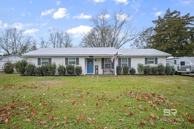 single story home featuring covered porch and a front yard