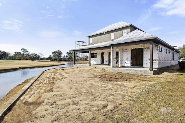 view of property exterior with a water view