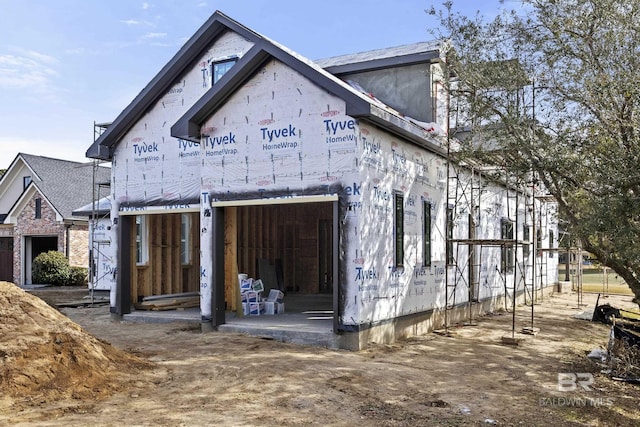 view of side of property featuring a garage