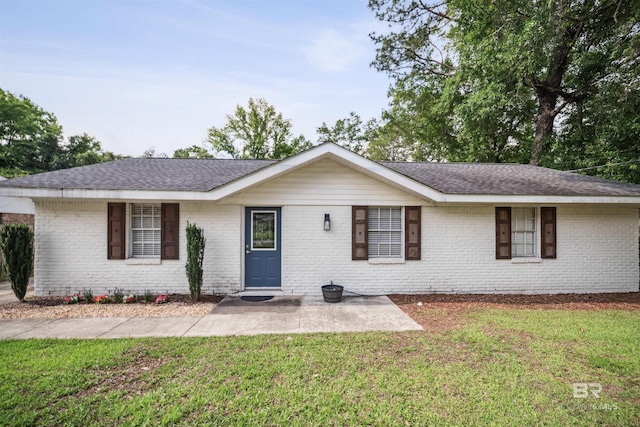 5917 Couton Dr, Mobile, AL 36693 - ranch-style home with brick siding, a front lawn, and a shingled roof
