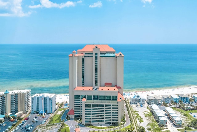 aerial view with a water view and a view of the beach