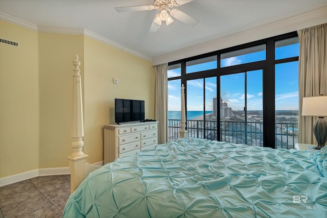 bedroom with a water view, ceiling fan, access to exterior, tile floors, and ornamental molding