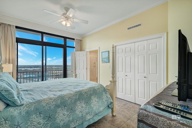 bedroom featuring ceiling fan, crown molding, access to outside, a closet, and tile floors