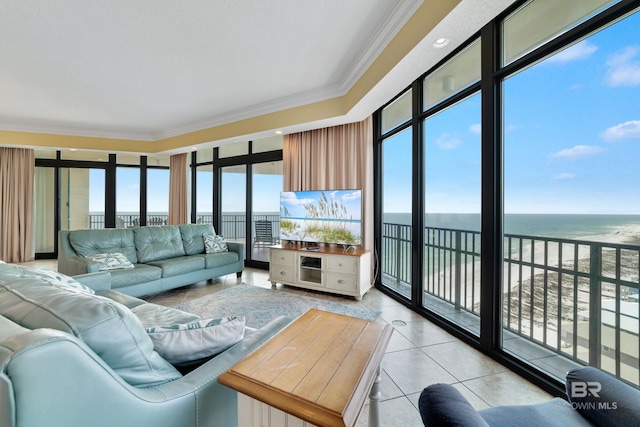 tiled living room featuring crown molding and a water view