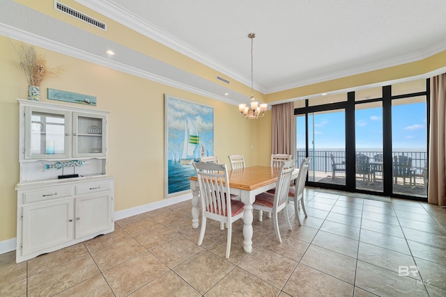 dining room featuring expansive windows, crown molding, light tile floors, and a chandelier