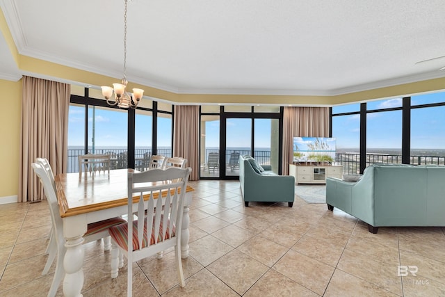 dining space featuring a healthy amount of sunlight, crown molding, and light tile floors