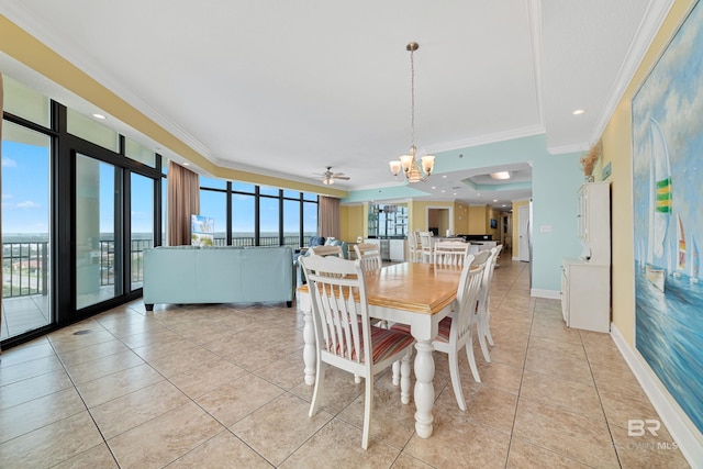 tiled dining area featuring ceiling fan with notable chandelier and crown molding