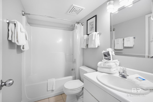 bathroom with vanity, tile patterned flooring, toilet, visible vents, and shower / bath combo with shower curtain