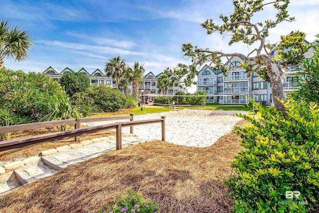 view of property's community featuring volleyball court and a residential view