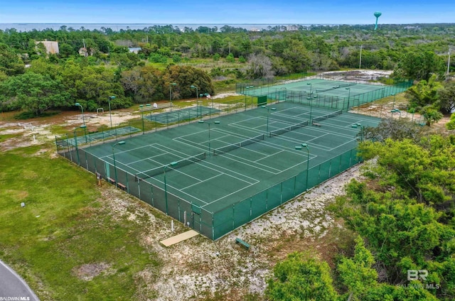 view of tennis court featuring fence