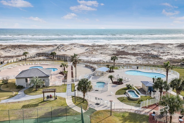 bird's eye view featuring a water view and a view of the beach