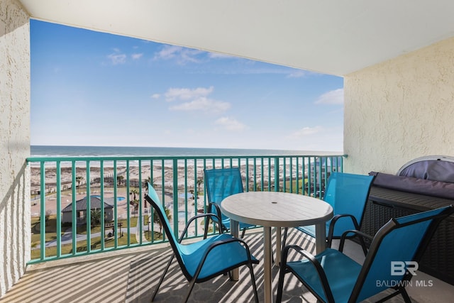 balcony with a beach view and a water view
