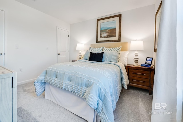 bedroom with carpet floors and baseboards