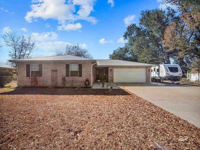 ranch-style house featuring a garage