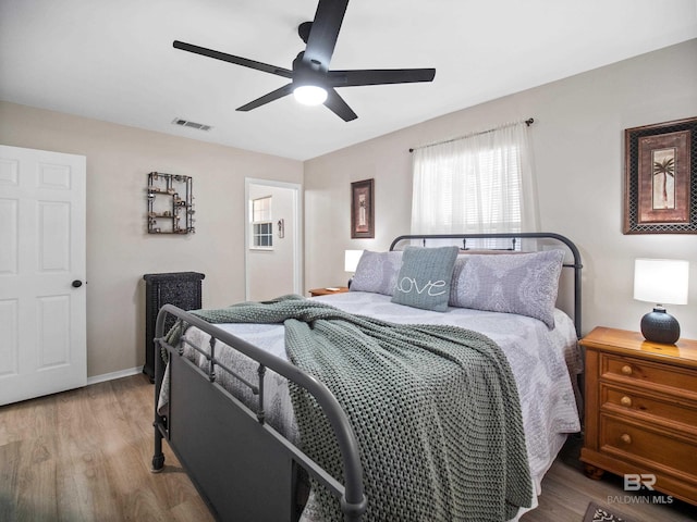 bedroom featuring hardwood / wood-style flooring and ceiling fan