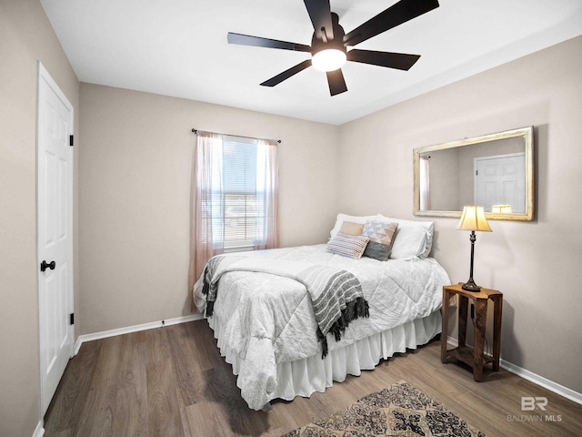 bedroom with hardwood / wood-style flooring and ceiling fan