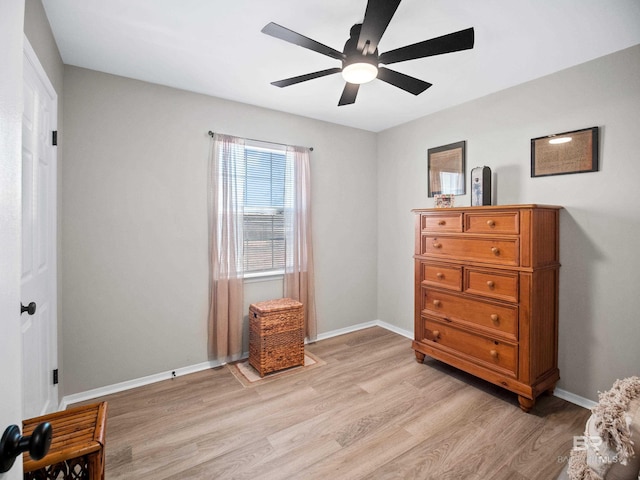 bedroom with ceiling fan and light hardwood / wood-style floors