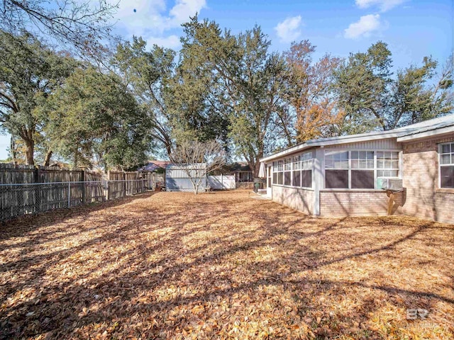 view of yard featuring a sunroom