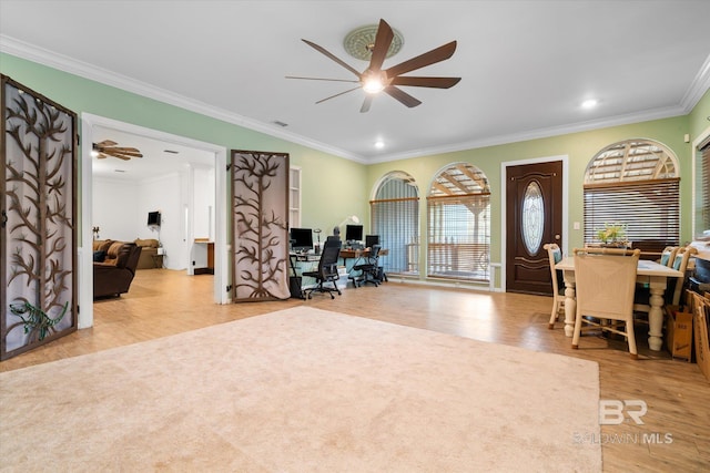 office area with ornamental molding, ceiling fan, and light wood-type flooring