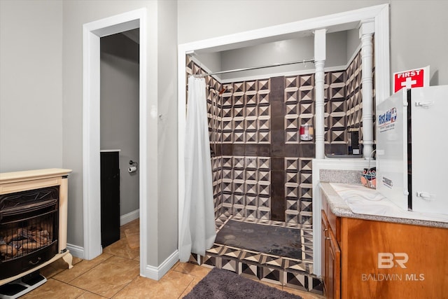 wine area with light tile patterned flooring, a fireplace, and heating unit