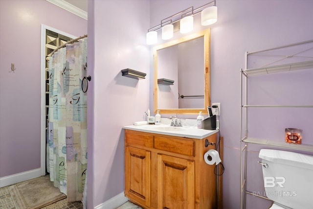 bathroom with ornamental molding, toilet, curtained shower, and vanity