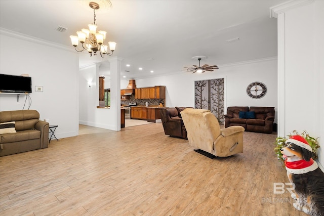 living room with crown molding, ceiling fan with notable chandelier, and light wood-type flooring