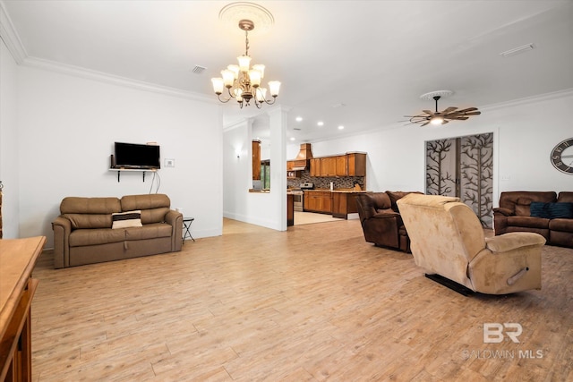 living room featuring ornamental molding, ceiling fan with notable chandelier, and light wood-type flooring