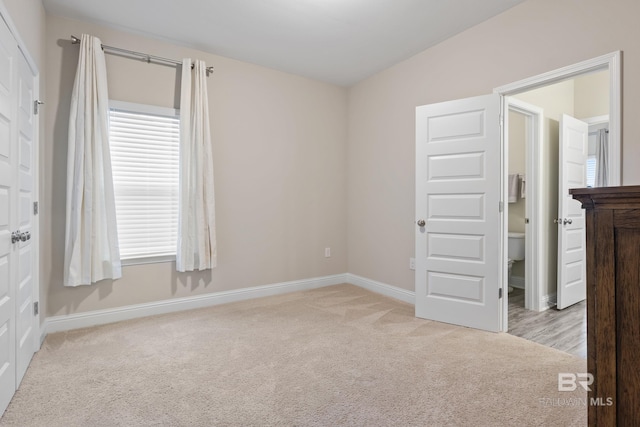 carpeted spare room featuring plenty of natural light