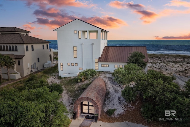 7276 Kiva Way, Gulf Shores, AL 36542 - outdoor structure at dusk with a water view